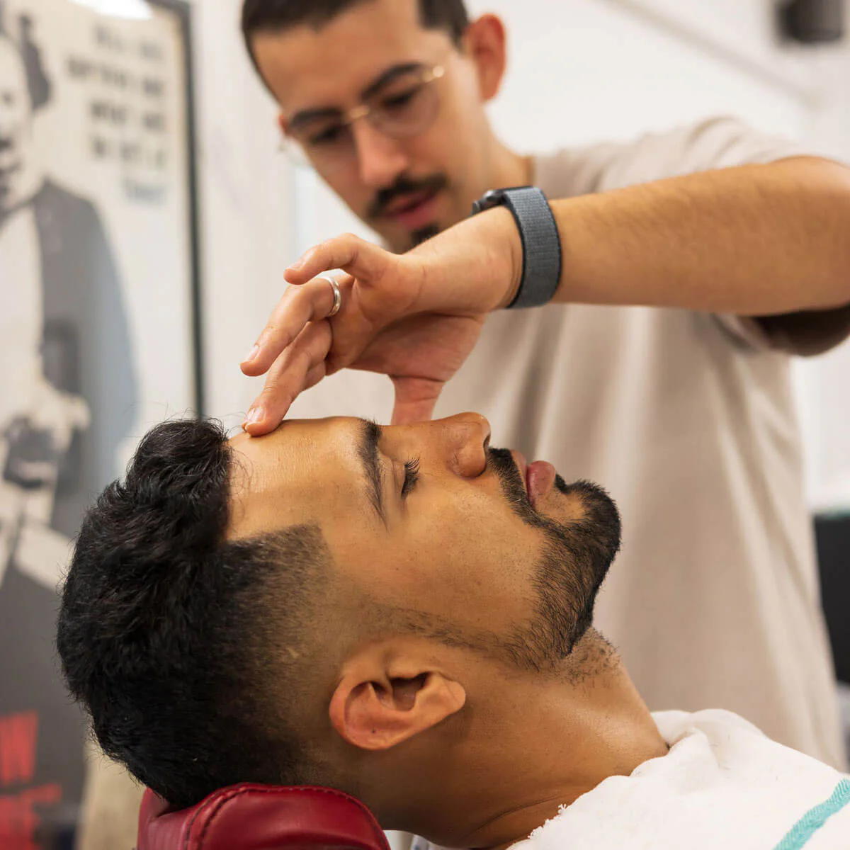 Barber styling a client at New Wave of SJ Barbershop