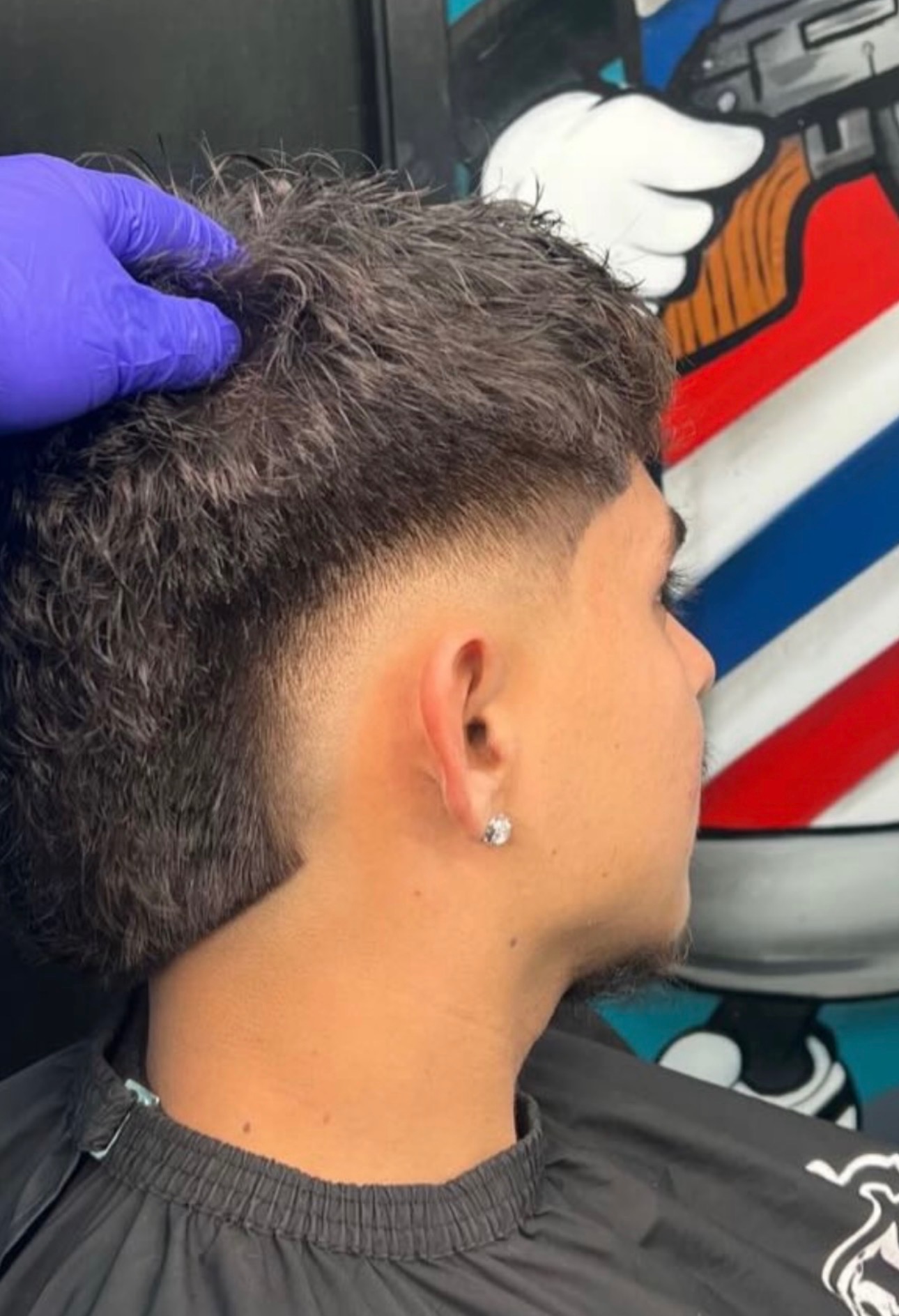 Blowout fade haircut with textured top